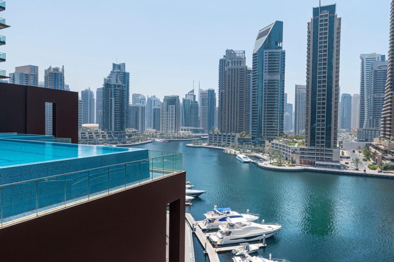 a water with boats and buildings in the background